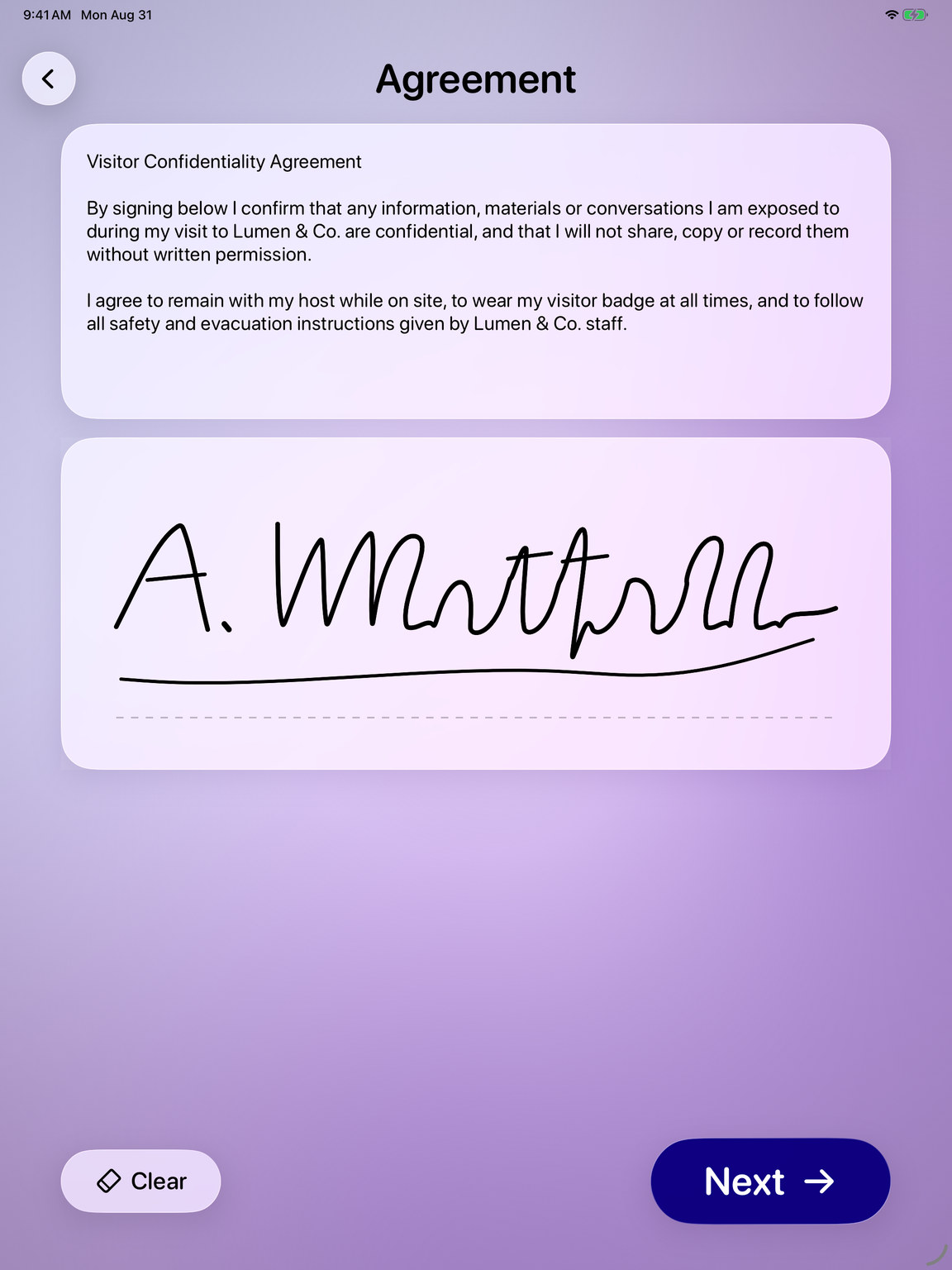 FrontDesk Genie agreement screen on iPad with a visitor signature